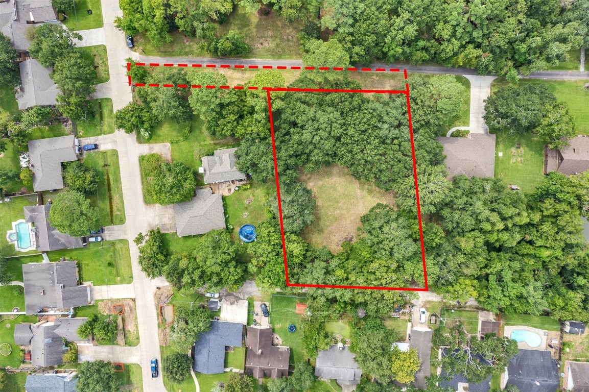 SURVEY VIEW – Red outline marks 3147 Hughes; broken lines show access drive