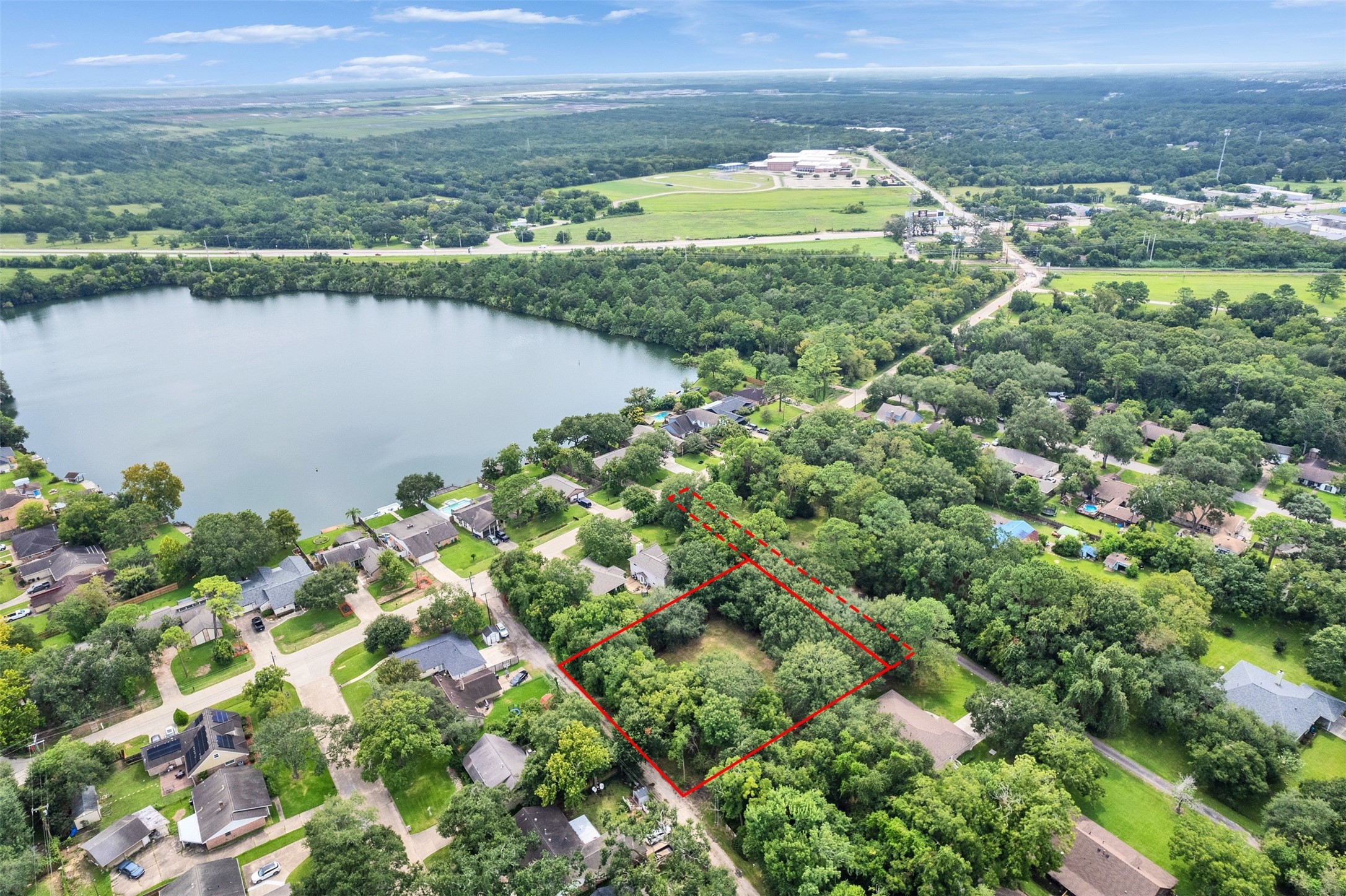 3147 Hughes Road Dickinson, TX 77539 - Photo 11 of 11 a view of a lake with a city