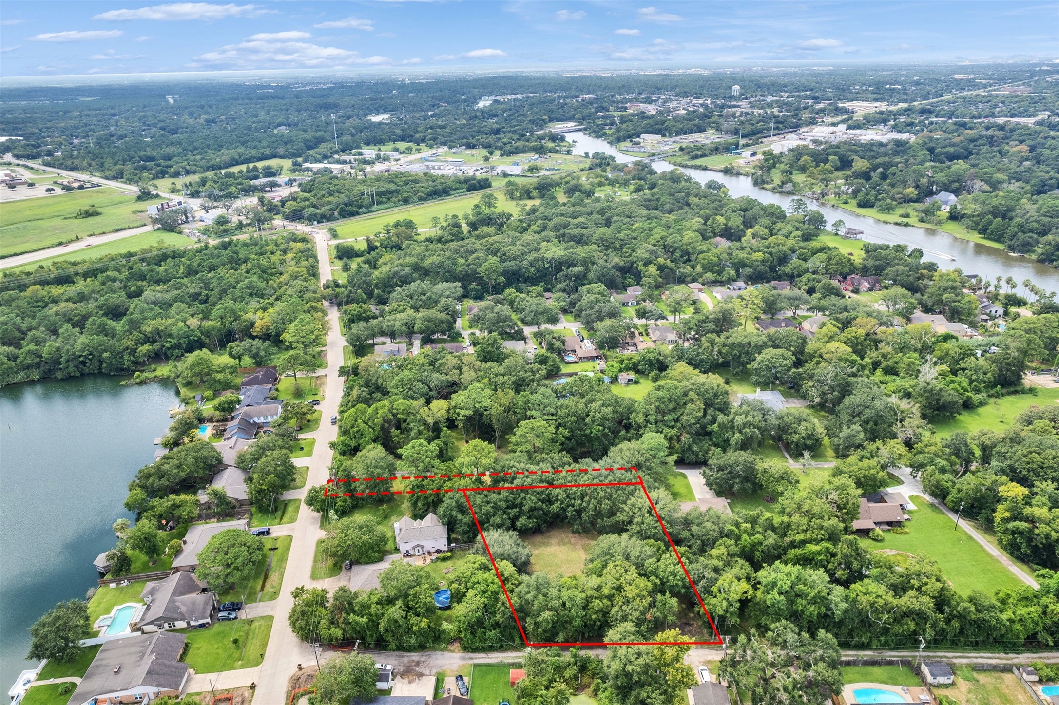 3147 Hughes Road Dickinson, TX 77539 - Photo 4 of 11 an aerial view of residential houses with outdoor space and trees