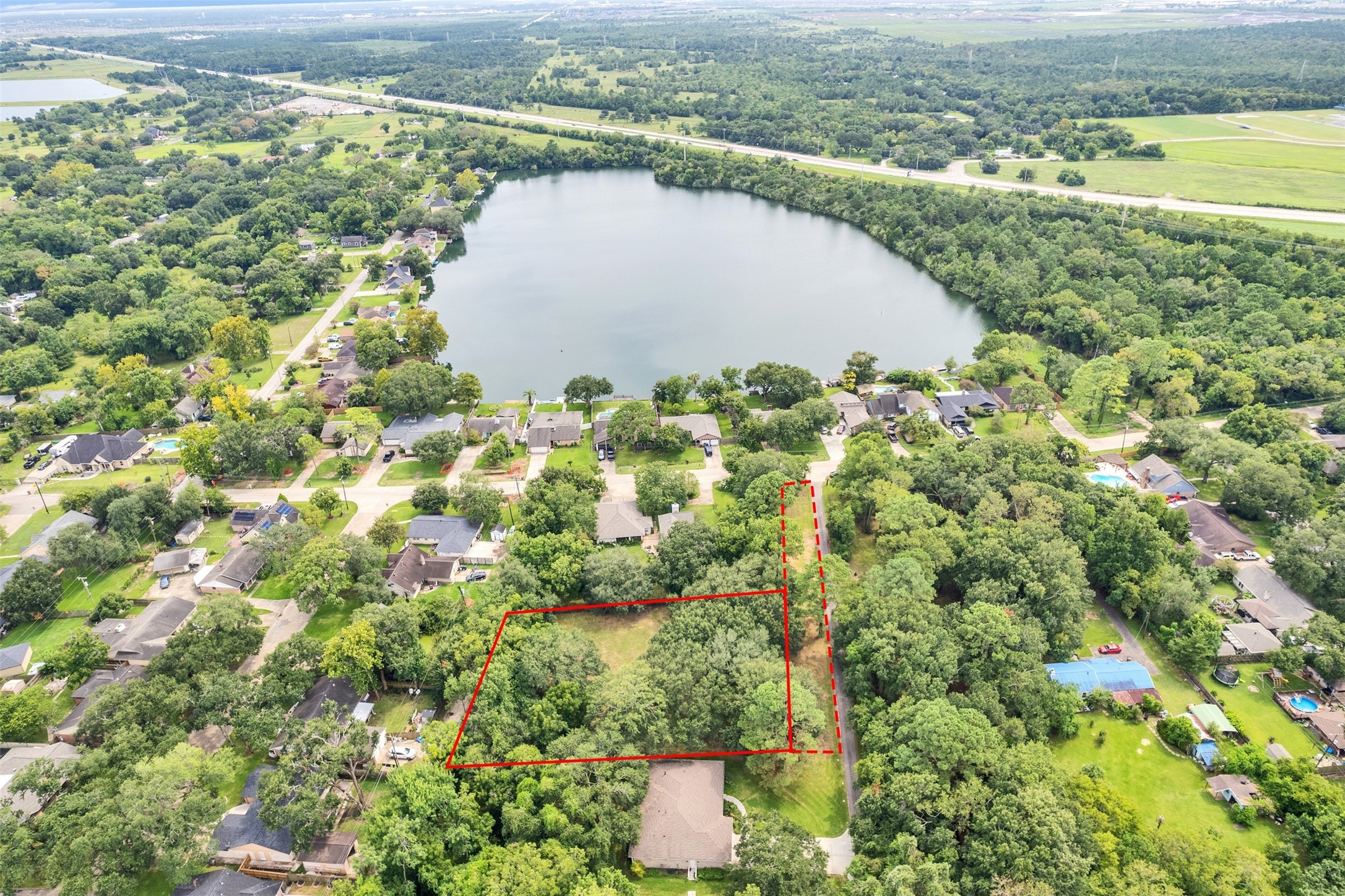 3147 Hughes Road Dickinson, TX 77539 - Photo 6 of 11 a view of a lake with a lake