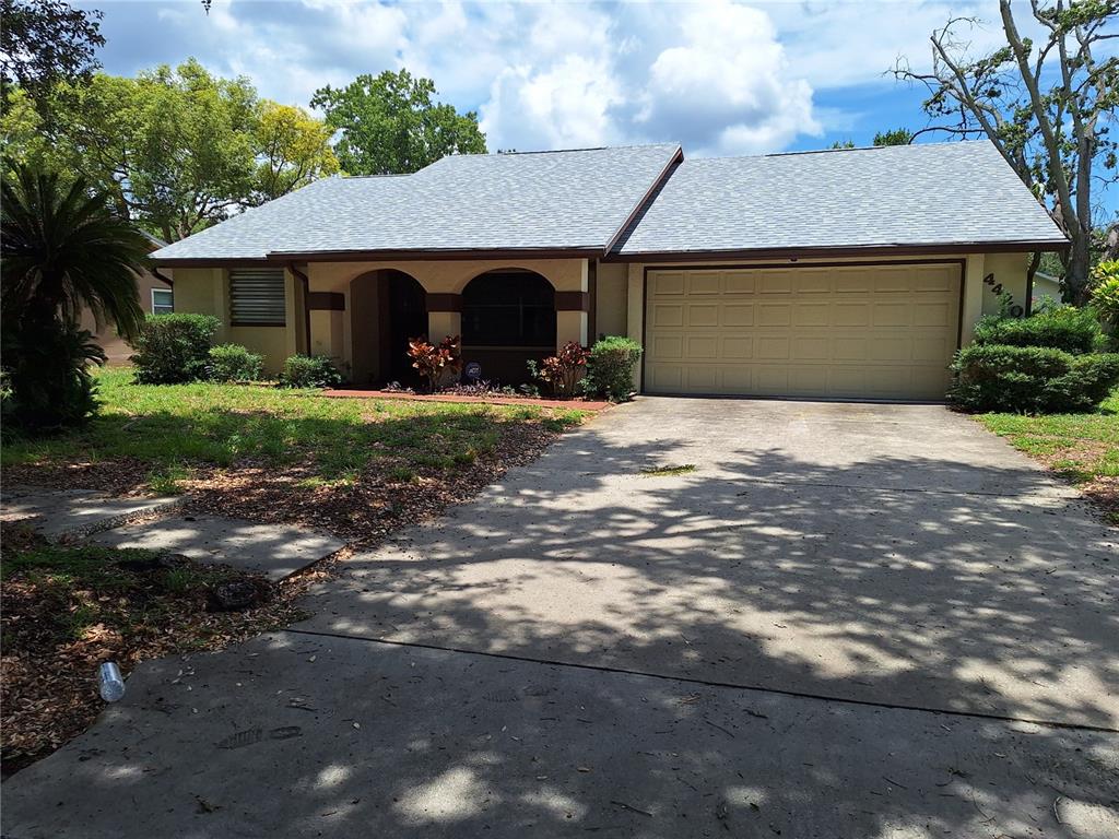 4420 Sawgrass Boulevard New Port Richey, FL 34653 - Photo 1 of 1 a front view of a house with a garden