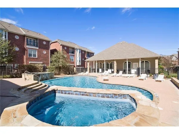 a view of swimming pool with outdoor seating