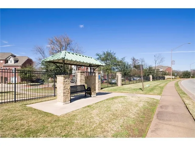 a view of a patio with a table and chairs