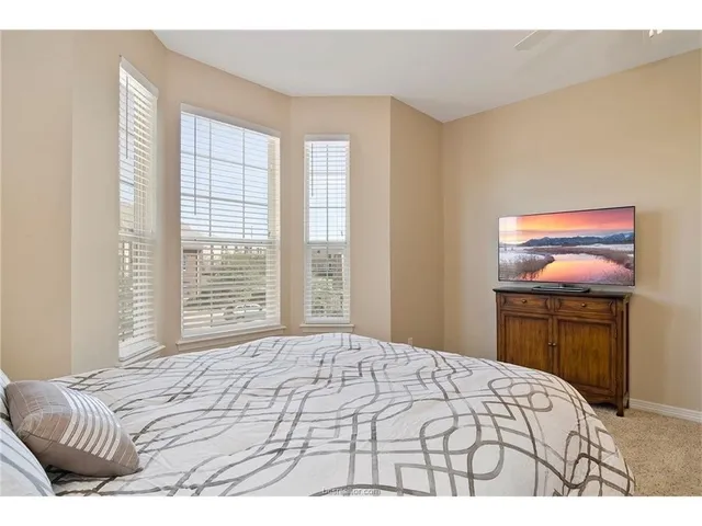 a bedroom with a bed and a cabinets
