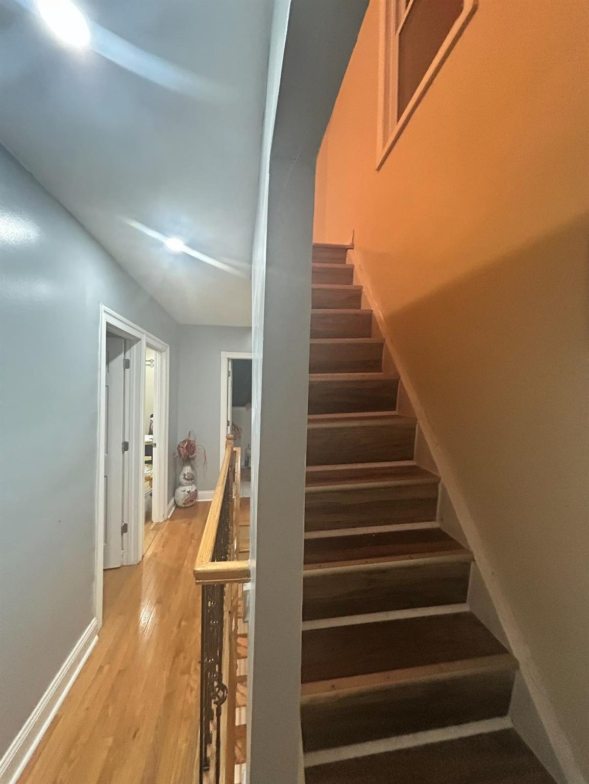 218-34 104th Avenue Queens, NY 11429 - Photo 18 of 27 Stairs with hardwood / wood-style flooring
