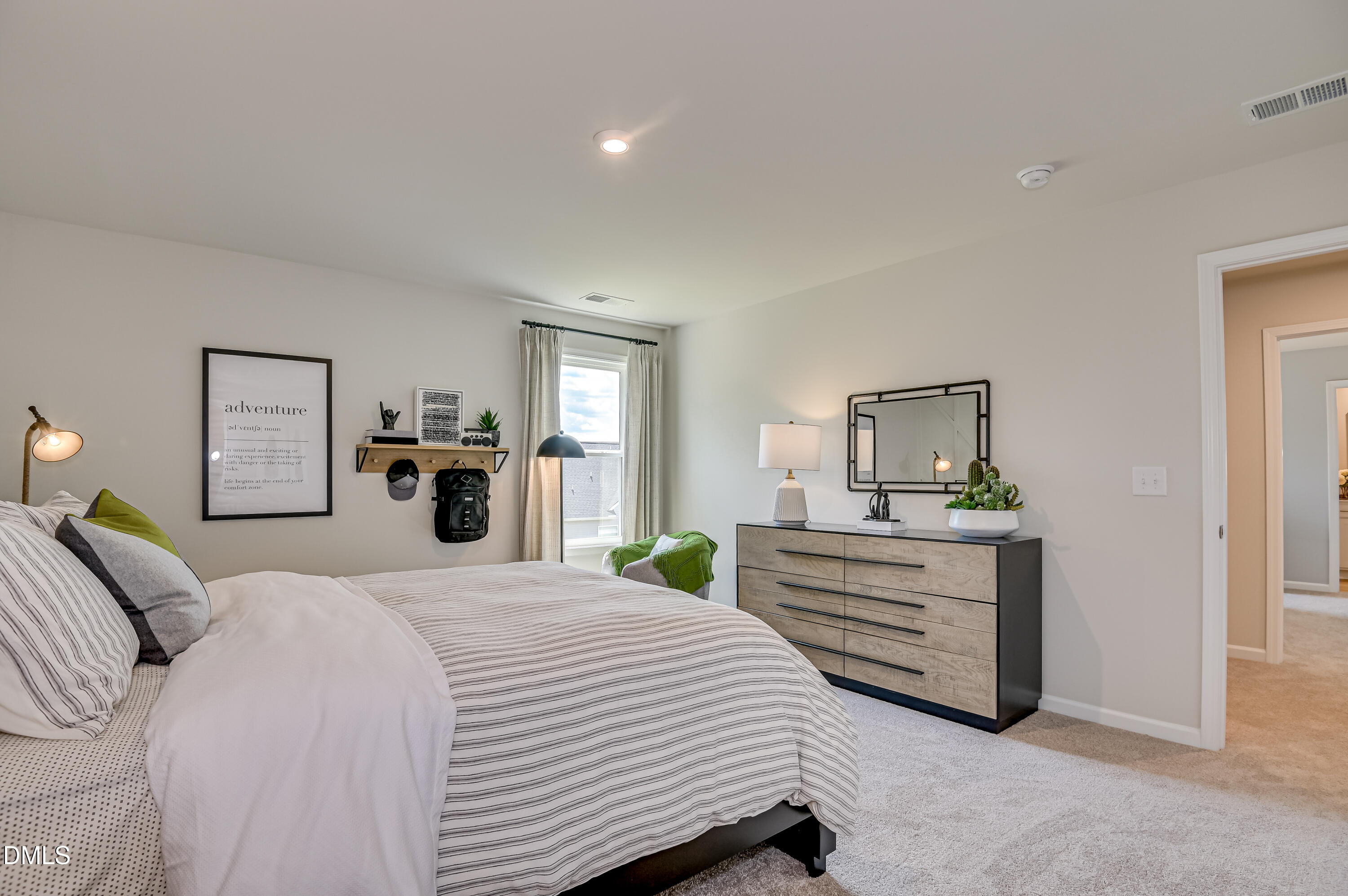 331 Jeter Grove Road Apex, NC 27523 - Photo 12 of 28 a bedroom with a bed and dresser