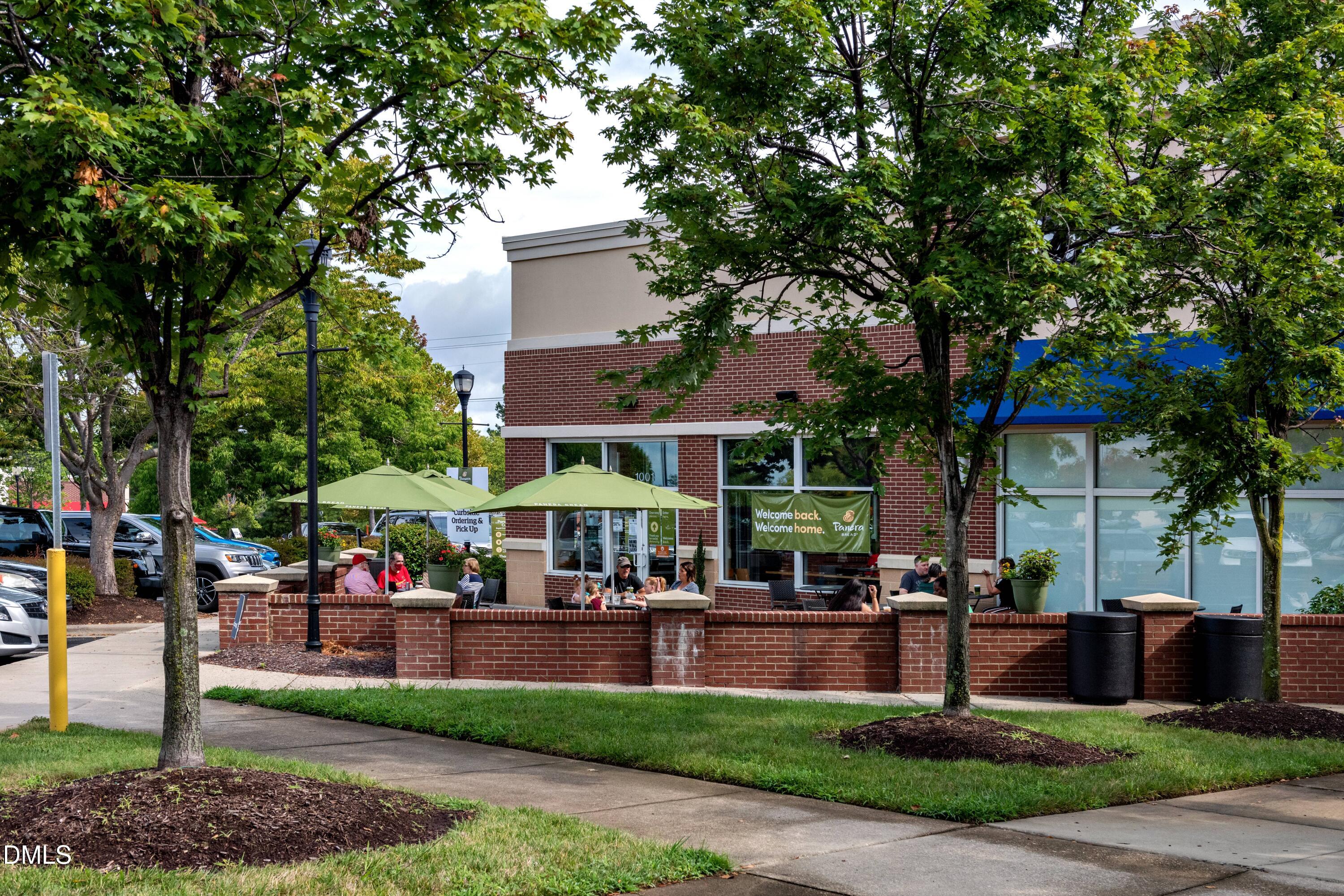 331 Jeter Grove Road Apex, NC 27523 - Photo 19 of 28 a group of people sitting in front of a building