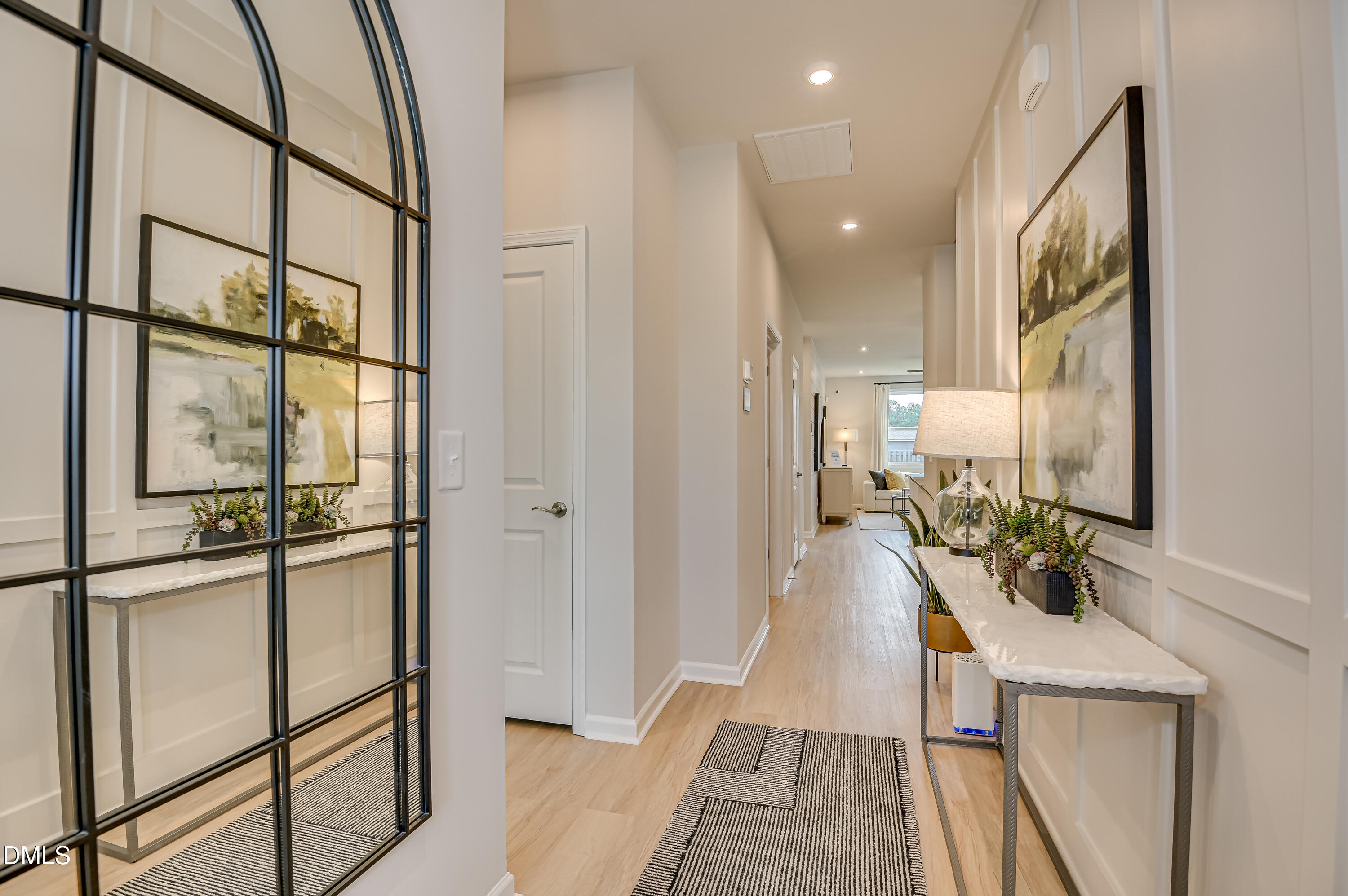 331 Jeter Grove Road Apex, NC 27523 - Photo 2 of 28 a hallway with a view of living room with furniture and a window