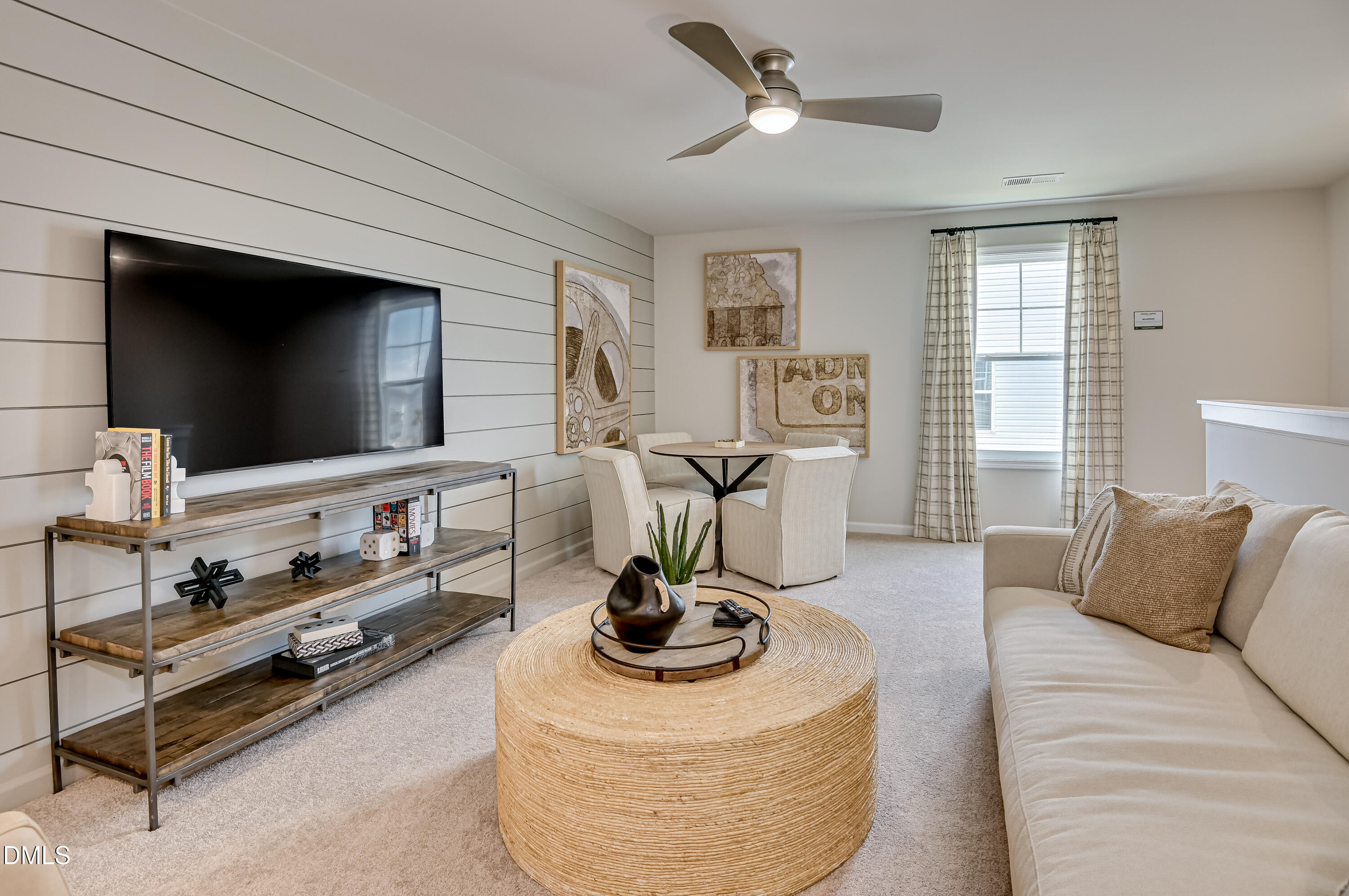 331 Jeter Grove Road Apex, NC 27523 - Photo 6 of 28 a living room with furniture and a flat screen tv