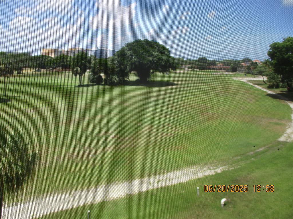 2651 South Course Drive, Unit 404 Pompano Beach, FL 33069 - Photo 12 of 40 a view of a lake with a city