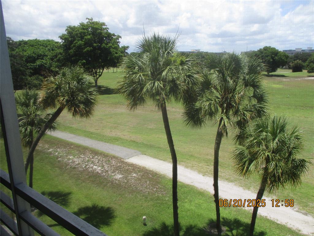 2651 South Course Drive, Unit 404 Pompano Beach, FL 33069 - Photo 13 of 40 a view of a lake from a balcony