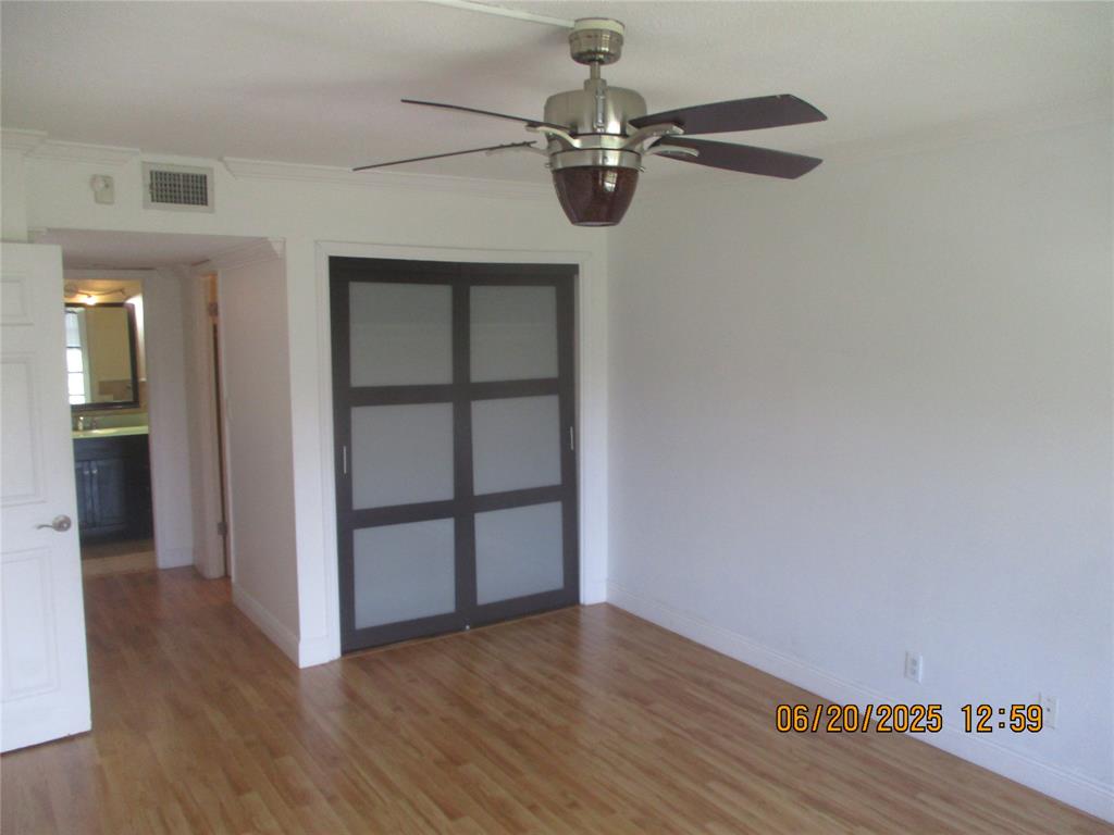 2651 South Course Drive, Unit 404 Pompano Beach, FL 33069 - Photo 16 of 40 a view of a room with wooden floor