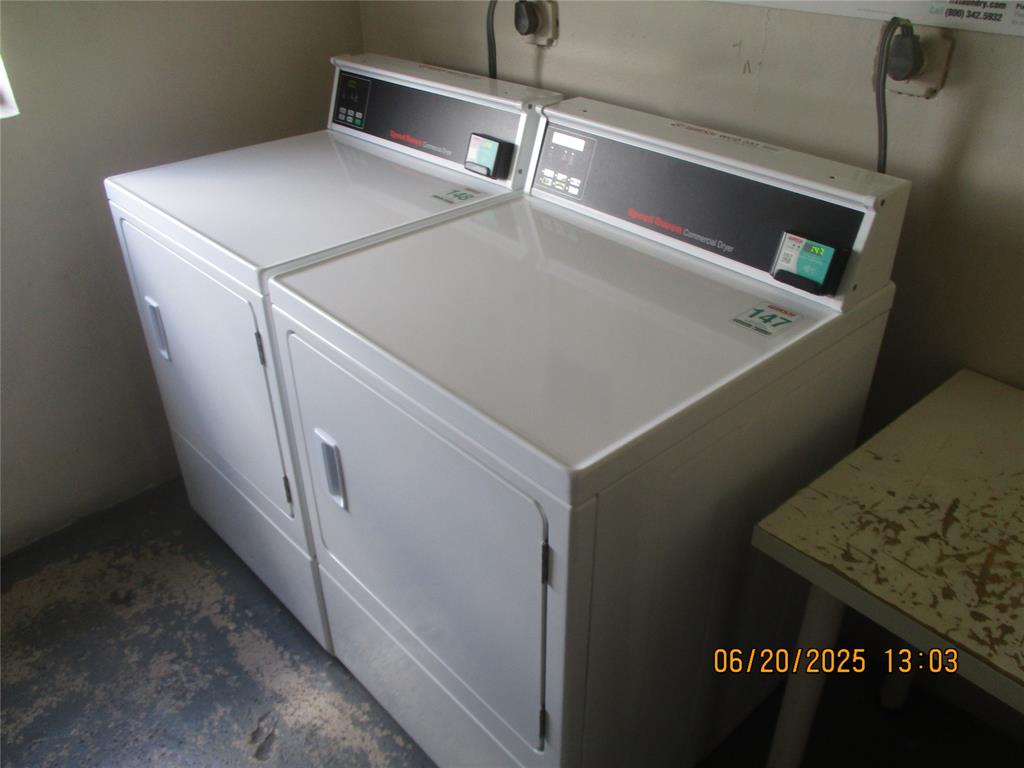 2651 South Course Drive, Unit 404 Pompano Beach, FL 33069 - Photo 25 of 40 a utility room with dryer and washer