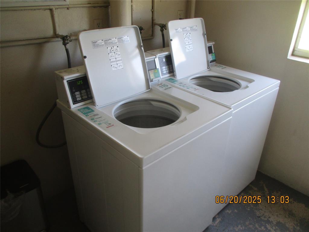 2651 South Course Drive, Unit 404 Pompano Beach, FL 33069 - Photo 26 of 40 a utility room with dryer and washer