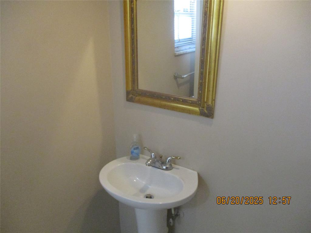 2651 South Course Drive, Unit 404 Pompano Beach, FL 33069 - Photo 3 of 40 a bathroom with a sink and a mirror