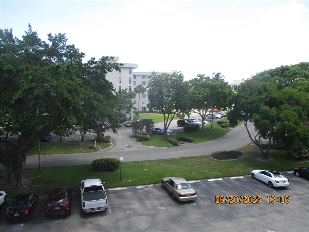 2651 South Course Drive, Unit 404 Pompano Beach, FL 33069 - Photo 32 of 40 an outdoor view with a lake view