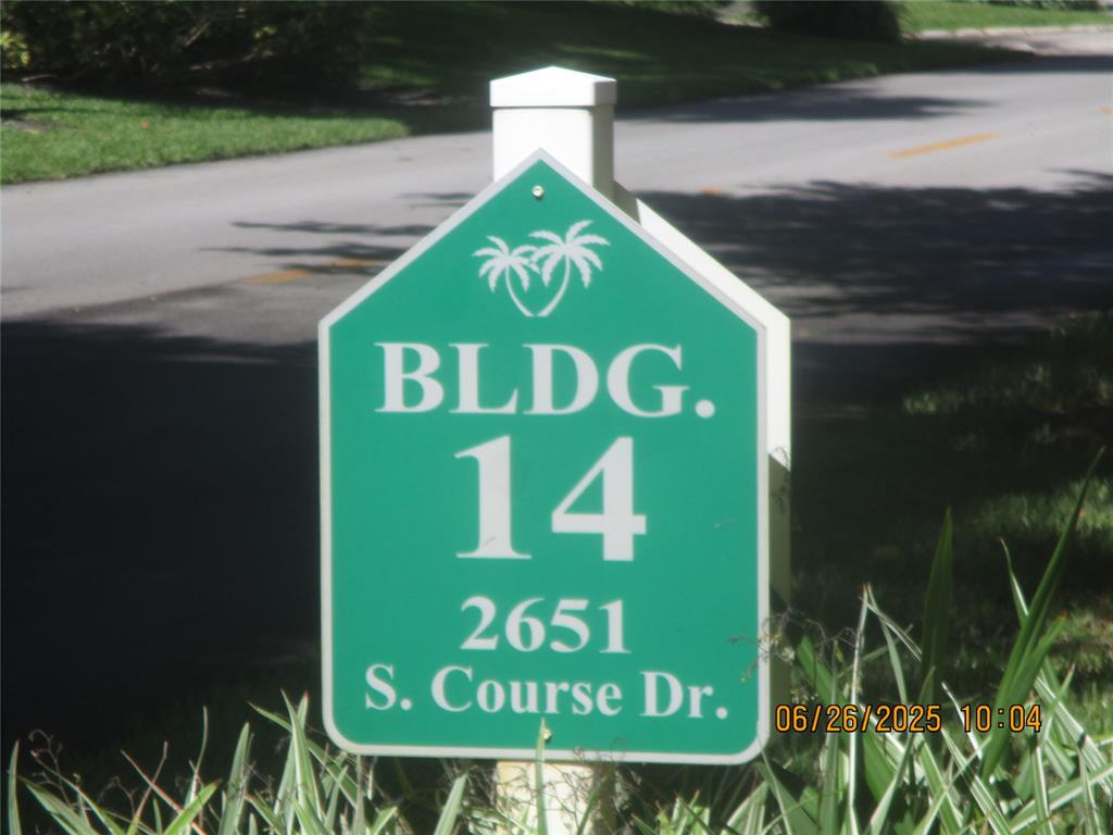 2651 South Course Drive, Unit 404 Pompano Beach, FL 33069 - Photo 35 of 40 a sign that is on the side of a building