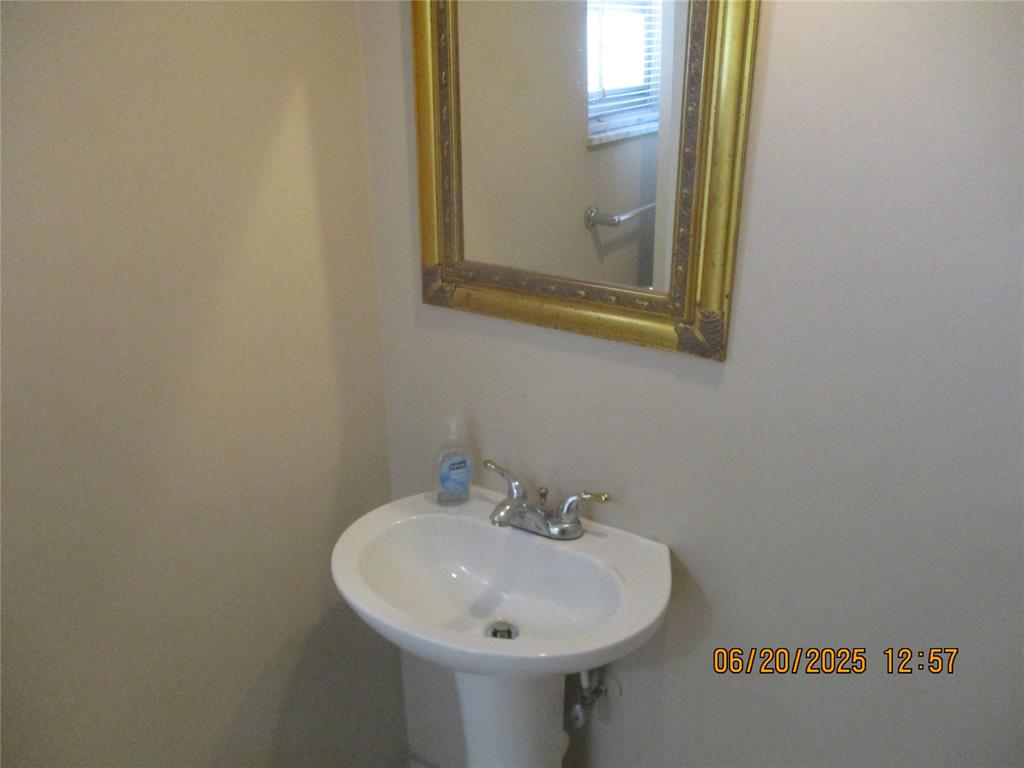 2651 South Course Drive, Unit 404 Pompano Beach, FL 33069 - Photo 4 of 40 a bathroom with a sink and a mirror