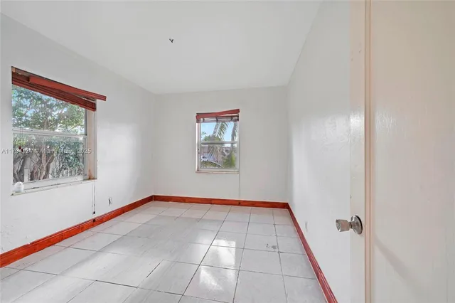 a view of an empty room and window