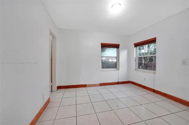 a view of an empty room and window