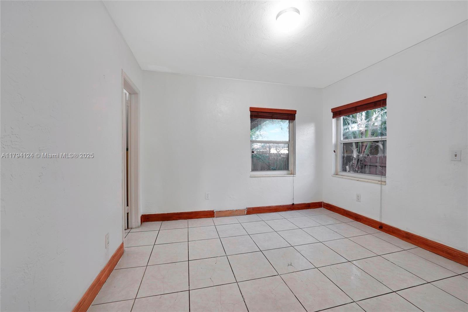 4241 West 1st Avenue Hialeah, FL 33012 - Photo 15 of 33 a view of an empty room and window