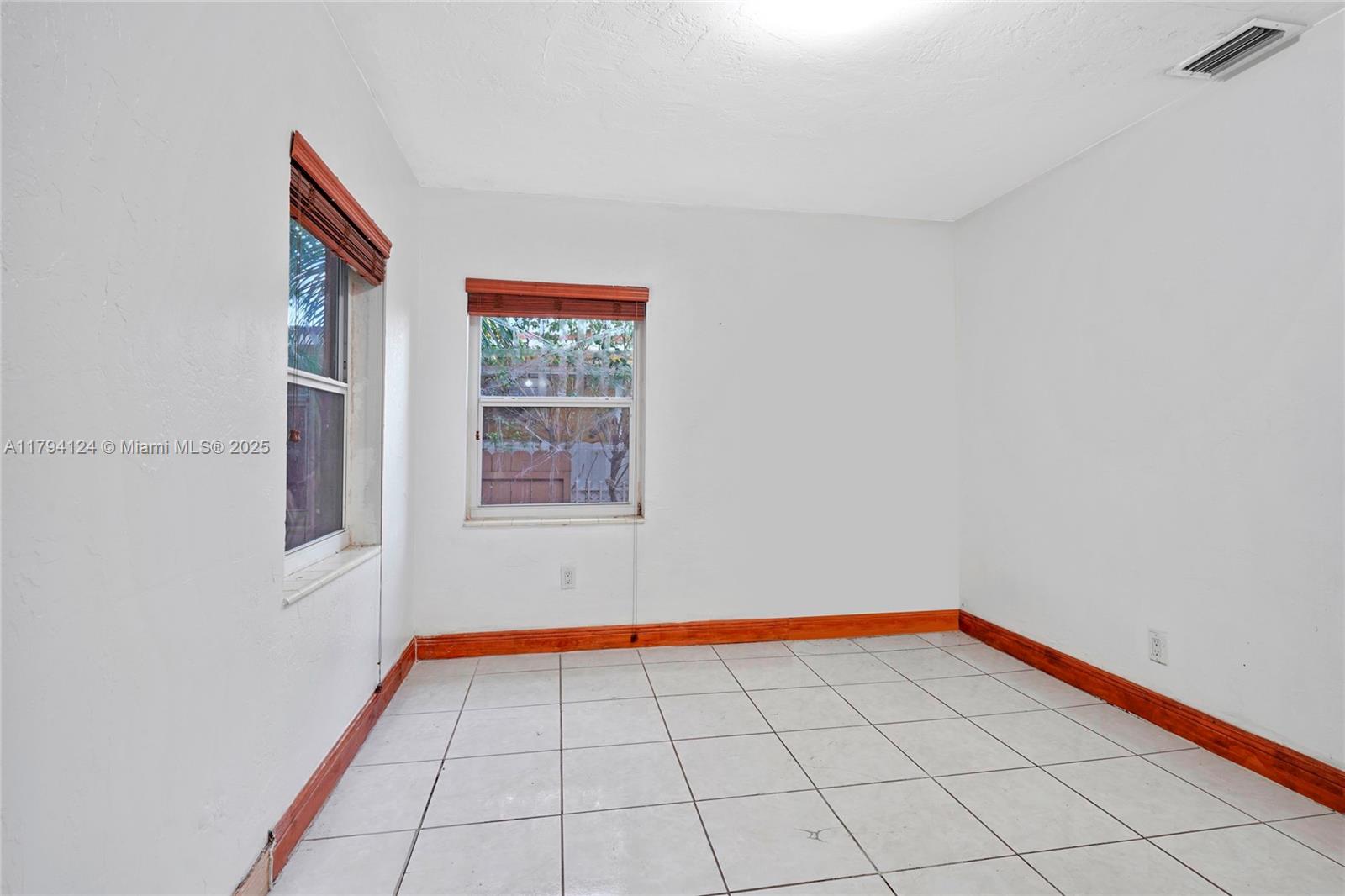 4241 West 1st Avenue Hialeah, FL 33012 - Photo 16 of 33 a view of an empty room and window