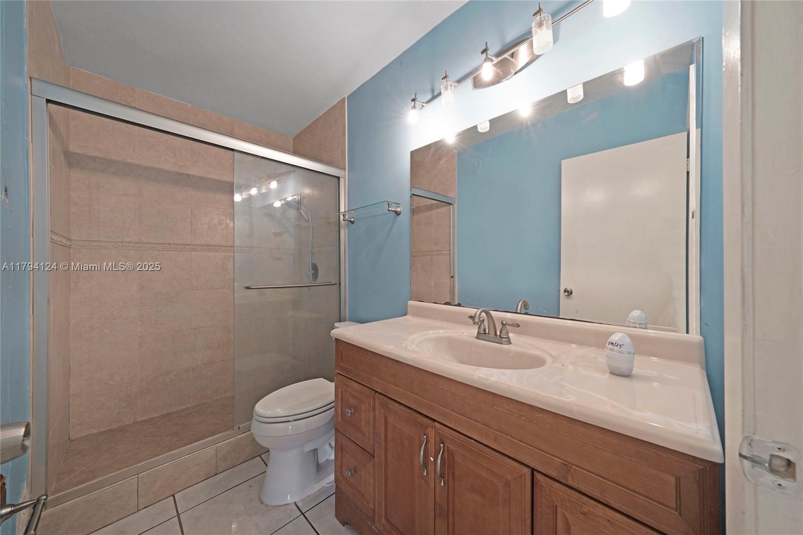 4241 West 1st Avenue Hialeah, FL 33012 - Photo 17 of 33 a bathroom with a sink a toilet and shower