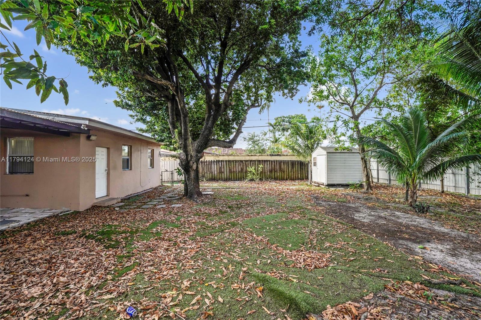 4241 West 1st Avenue Hialeah, FL 33012 - Photo 27 of 33 a house with trees in front of it