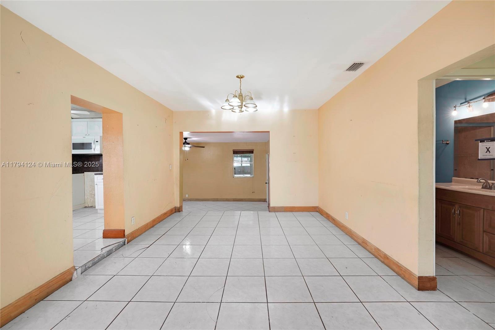 4241 West 1st Avenue Hialeah, FL 33012 - Photo 6 of 33 a view of an empty room and window