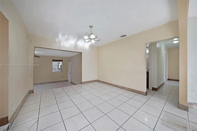 a kitchen with stainless steel appliances a sink a stove and cabinets