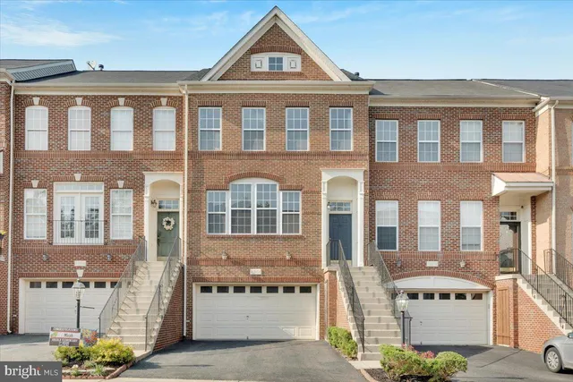 a front view of a building with a lot of windows