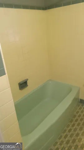 a bathroom with a bathtub