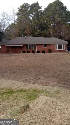 a view of house with outdoor space