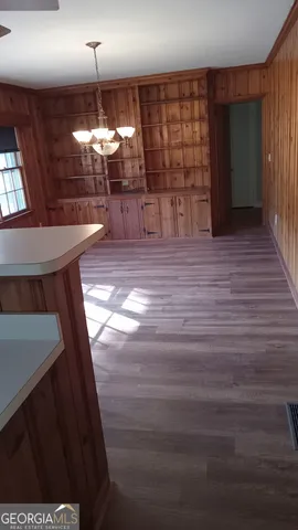 a view of a livingroom with furniture and chandelier