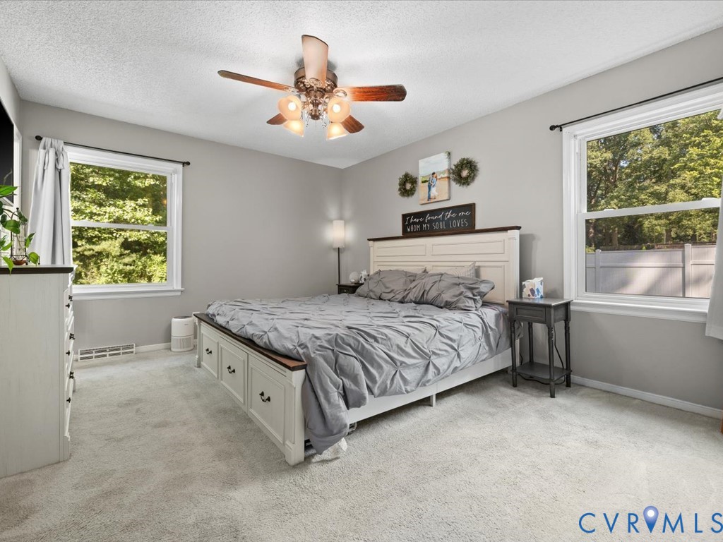 12724 South Chester Road Chester, VA 23831 - Photo 21 of 37 Plush gray carpeting and a ceiling fan with two wi