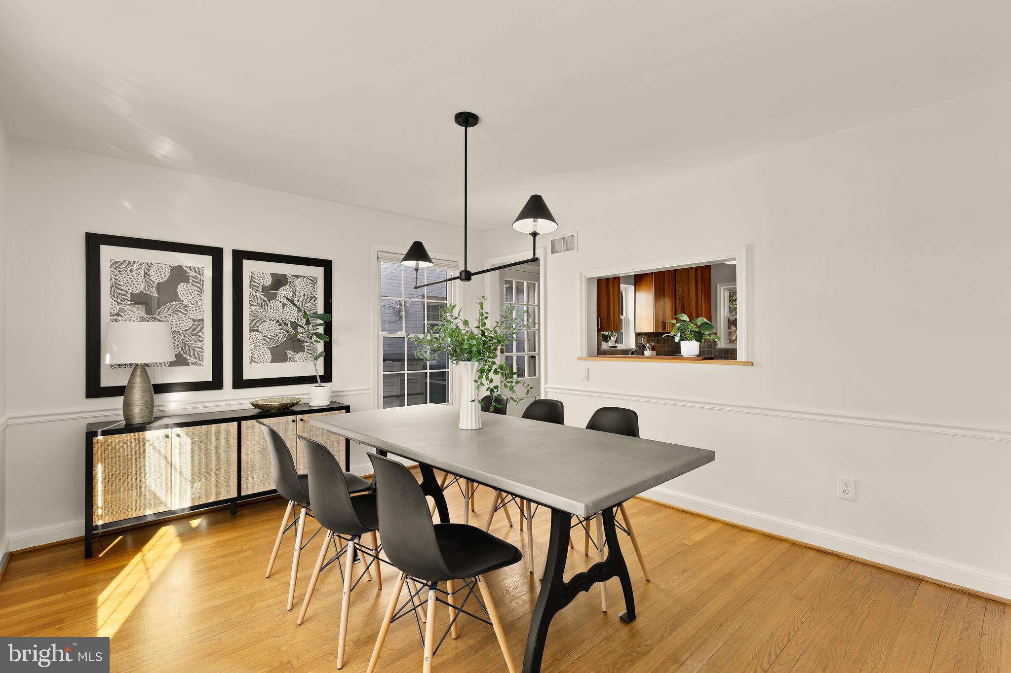 5705 MacArthur Boulevard Northwest Washington, DC 20016 - Photo 12 of 40 a view of a dining room with furniture and a flat screen tv