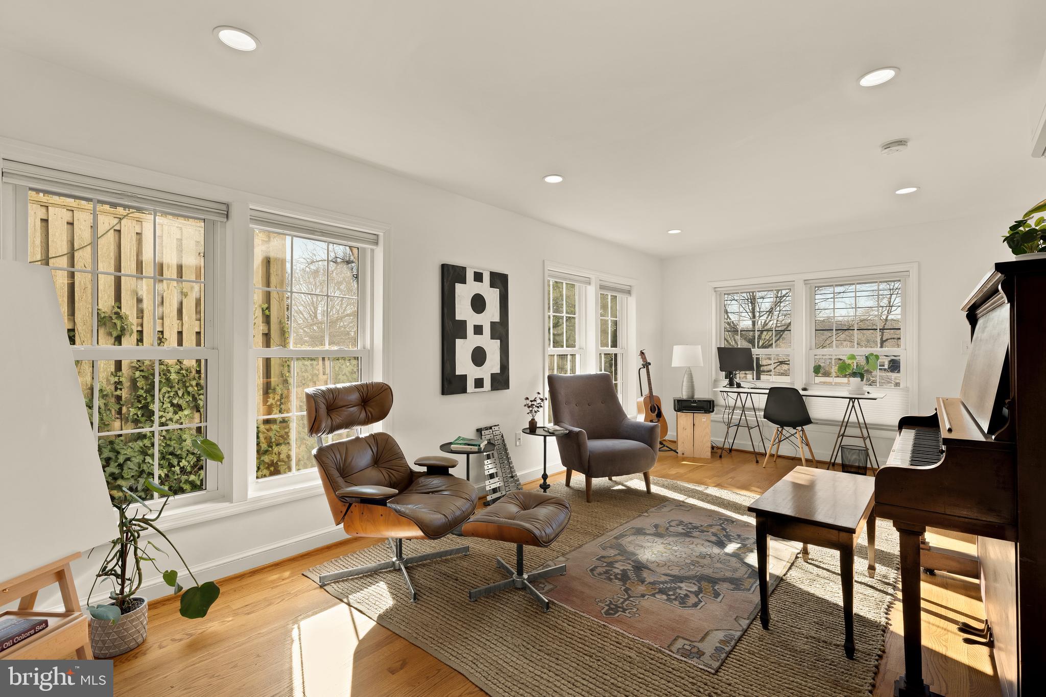 5705 MacArthur Boulevard Northwest Washington, DC 20016 - Photo 15 of 40 a living room with furniture and a potted plant