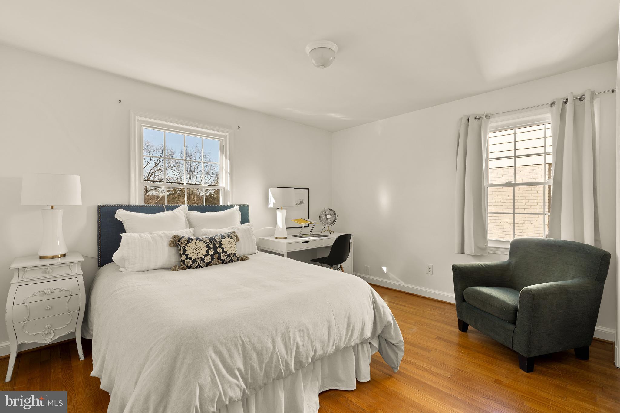 5705 MacArthur Boulevard Northwest Washington, DC 20016 - Photo 22 of 40 a bedroom with a bed couch and a window