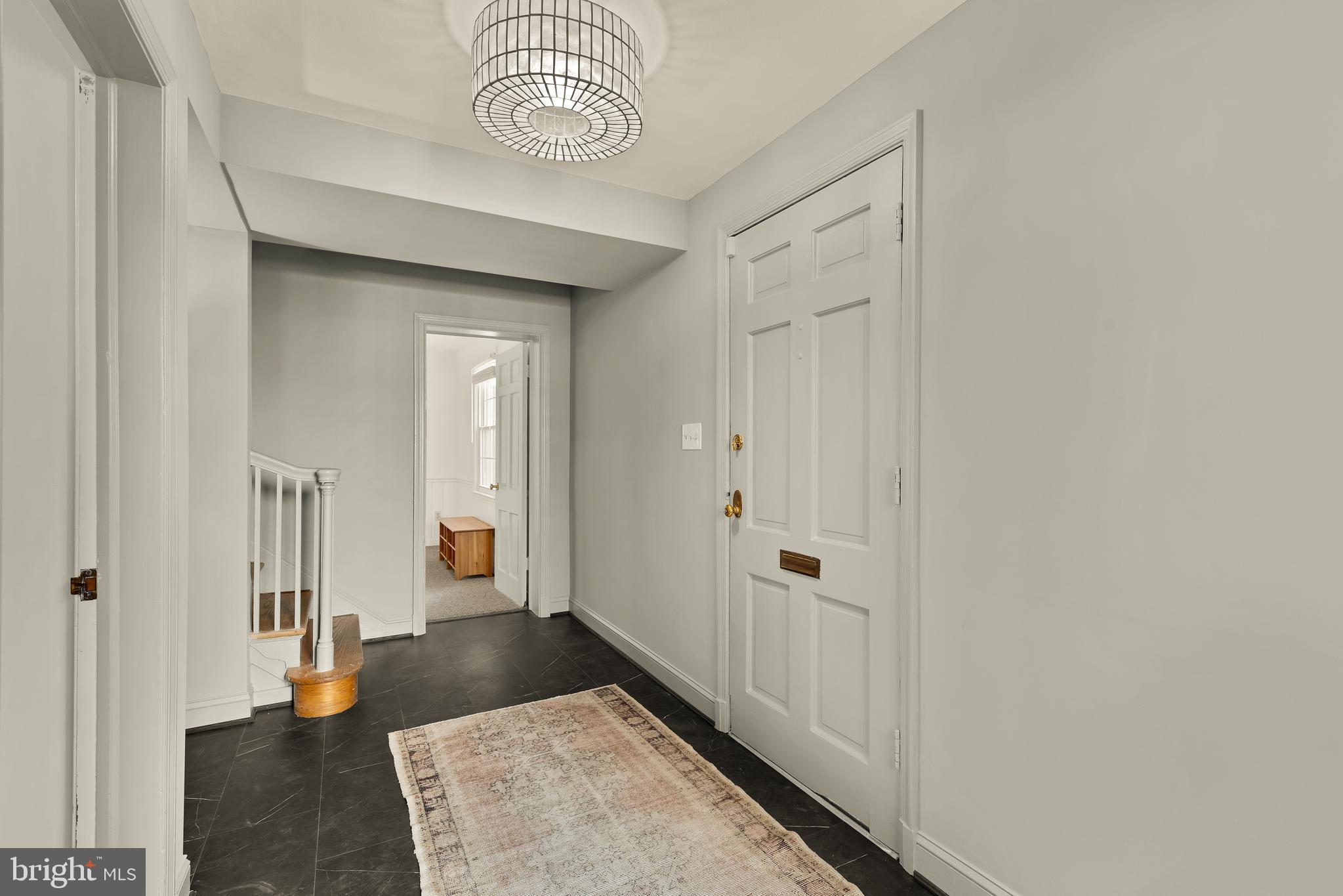 5705 MacArthur Boulevard Northwest Washington, DC 20016 - Photo 3 of 40 a view of a hallway with wooden floor