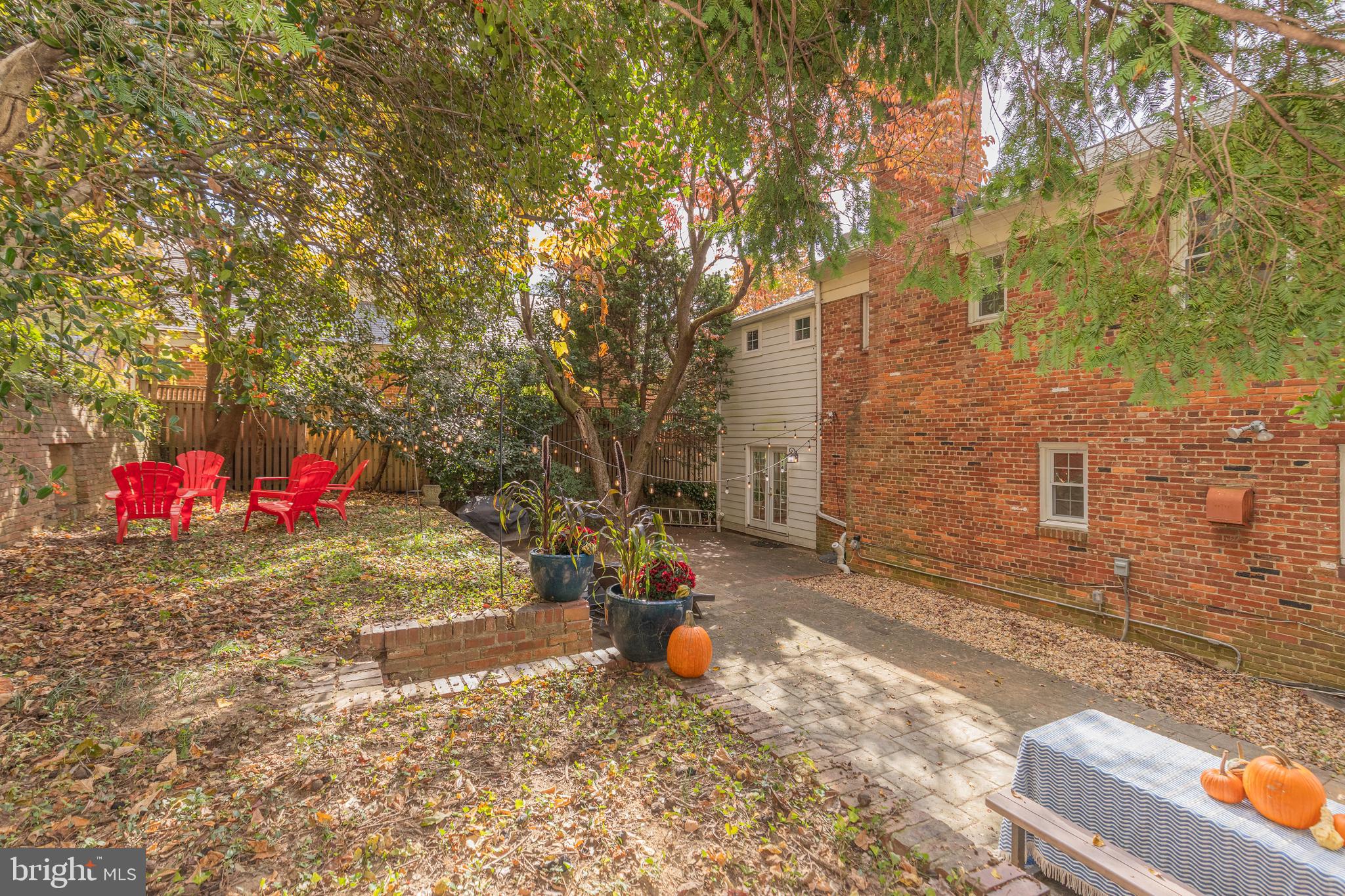 5705 MacArthur Boulevard Northwest Washington, DC 20016 - Photo 37 of 40 a backyard of a house with table and chairs
