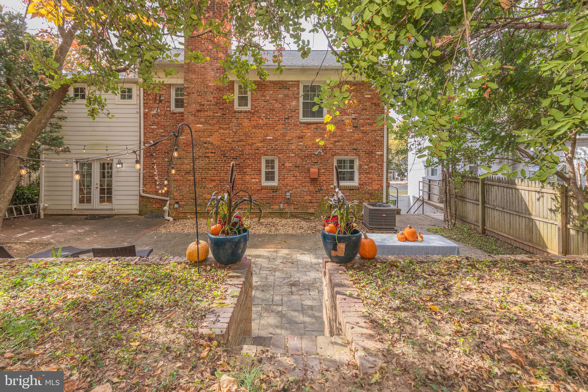 5705 MacArthur Boulevard Northwest Washington, DC 20016 - Photo 38 of 40 a view of a brick house with many windows next to a road