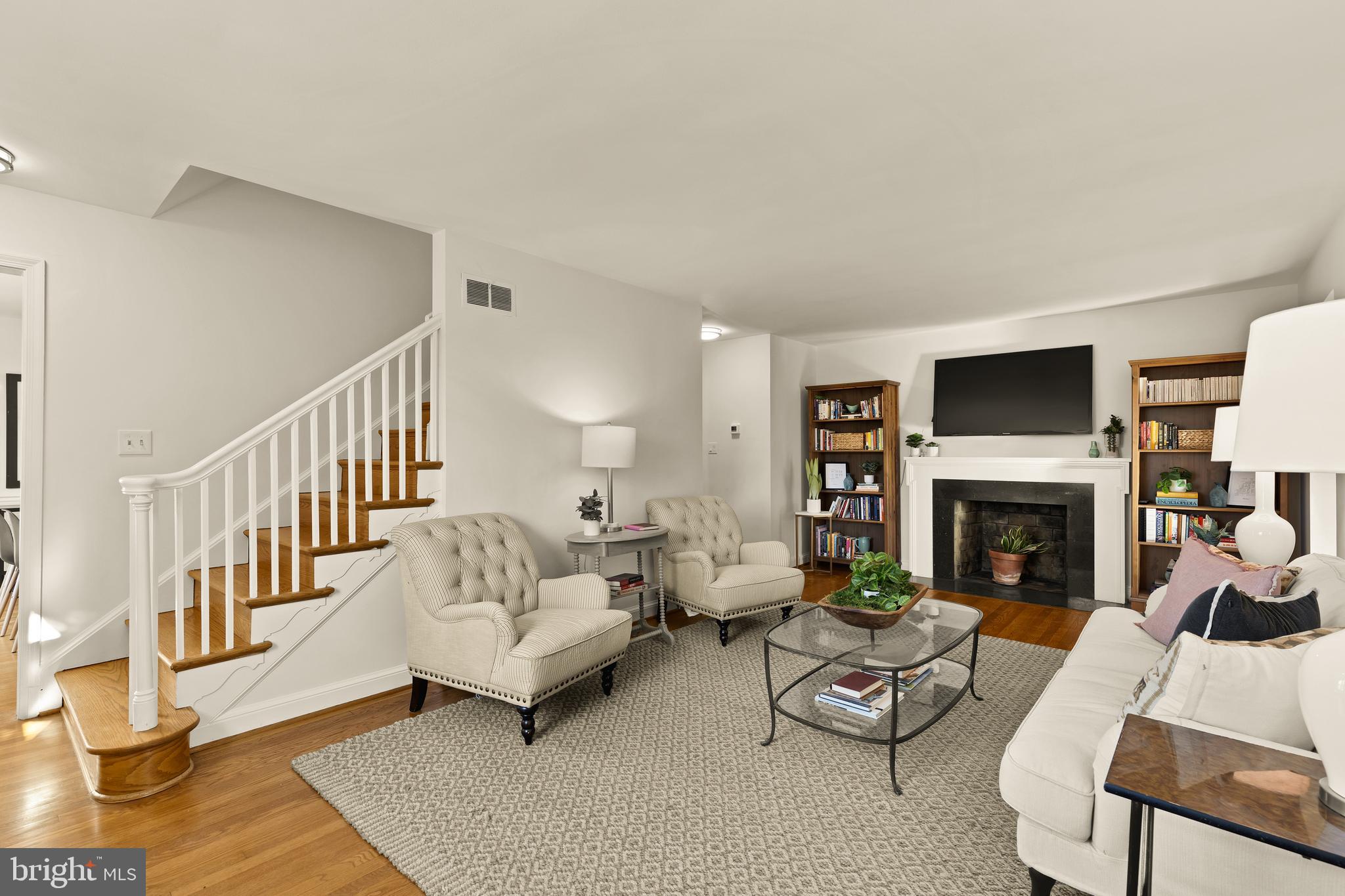 5705 MacArthur Boulevard Northwest Washington, DC 20016 - Photo 7 of 40 a living room with furniture a fireplace and a fireplace