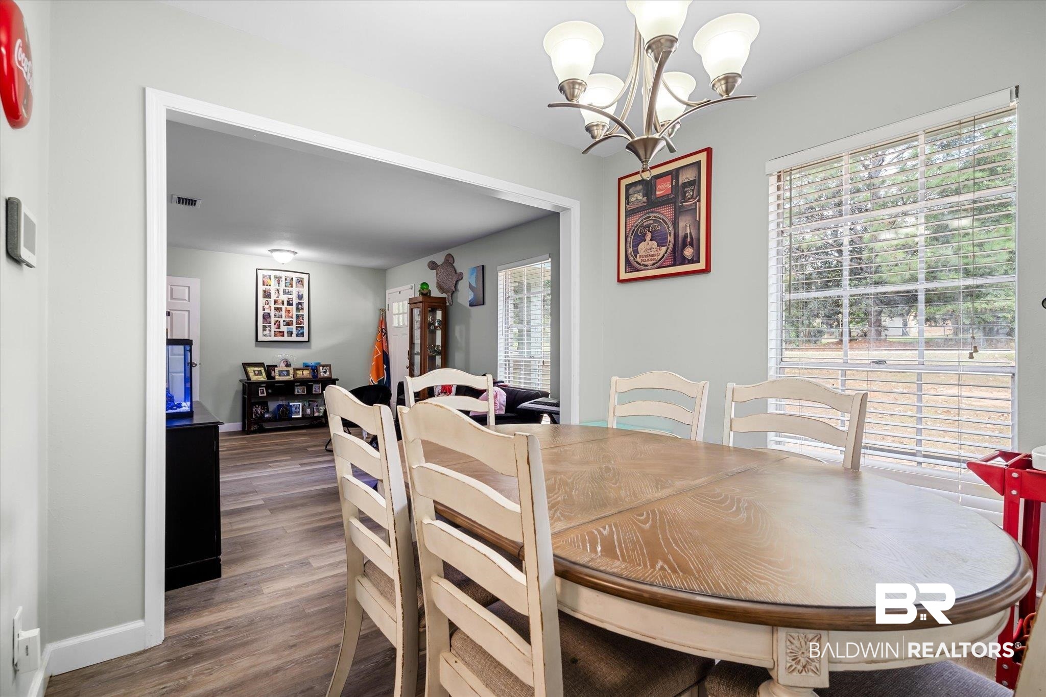 9987 Downing Street Semmes, AL 36575 - Photo 3 of 20 Dining room with dark wood-type flooring and a chandelier
