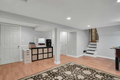 a view of a hallway with seating area
