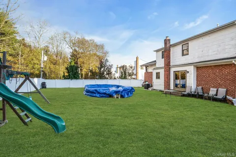 a house view with a sitting space and garden