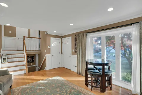 a bedroom with furniture a fireplace and stairs