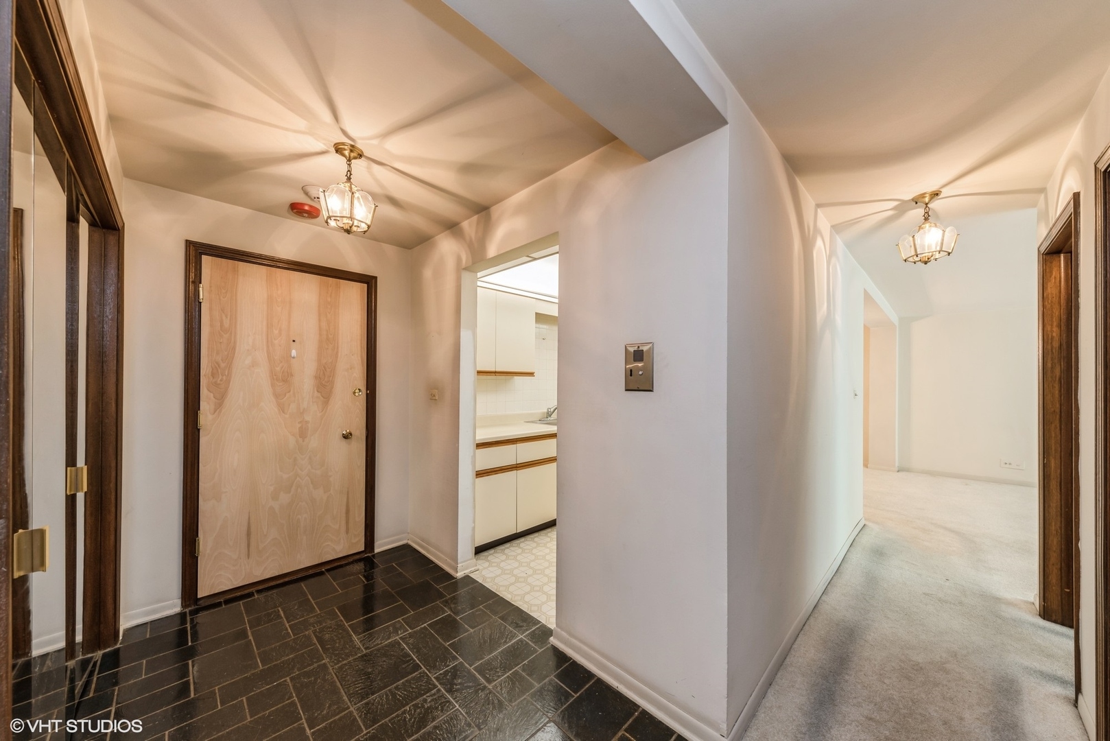 400 Thames Parkway, Unit 1L Park Ridge, IL 60068 - Photo 2 of 14 an empty room with wooden floor fan and windows
