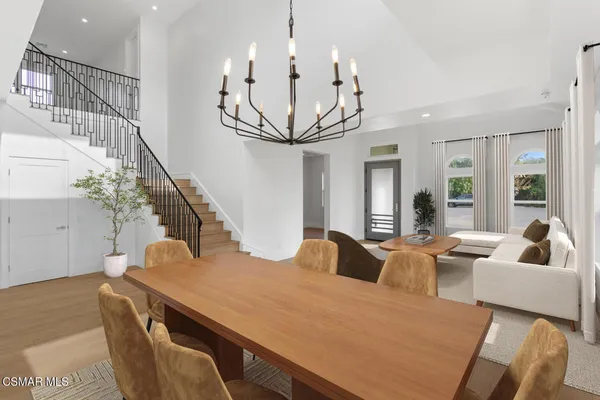 a kitchen with stainless steel appliances a sink a stove and a wooden floors