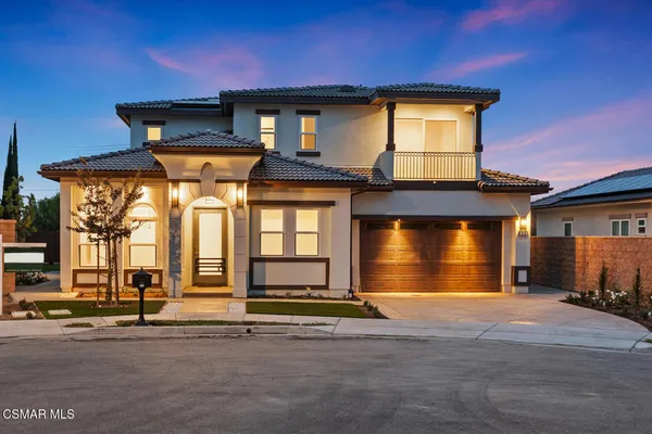 a front view of a house with a garage