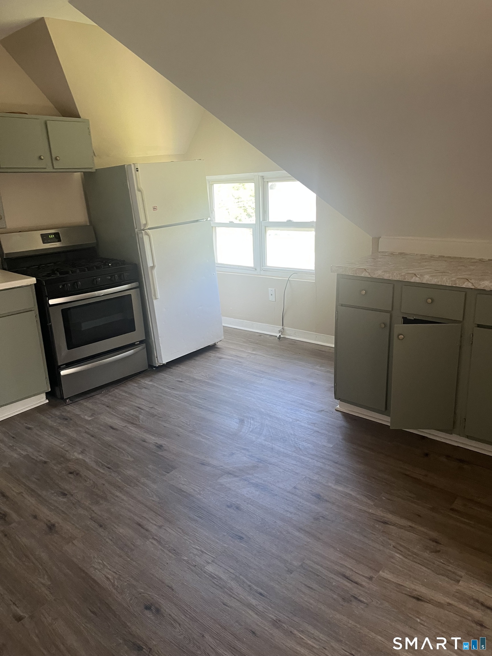 288 Cook Avenue Meriden, CT 06451 - Photo 2 of 11 a view of a kitchen with wooden floor and electronic appliances